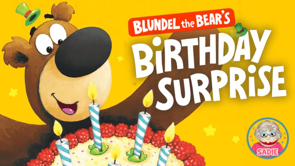 A cheerful cartoon bear named Blundel is smiling next to a colorful birthday cake with lit candles, set against a bright yellow background, featuring the text 'Blundel the Bear's Birthday Surprise'.