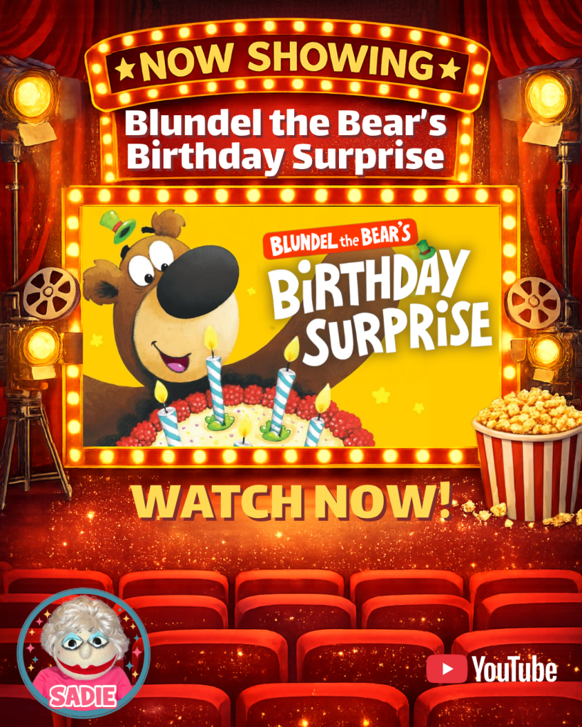 Promotional image for 'Blundel the Bear's Birthday Surprise', featuring a bear and a birthday cake with candles, set in a theatre environment with red curtains and spotlight effects.